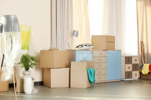 Moving truck and boxes outside a Greenwich home during a local relocation