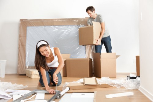 Packing materials and labelled boxes prepared for a Greenwich home move