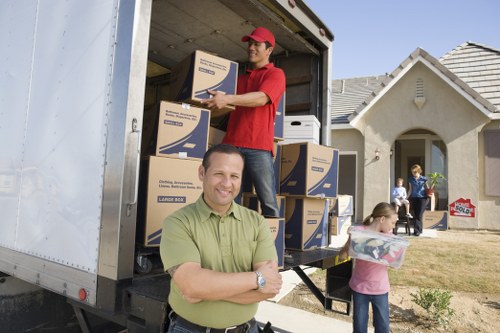 Packed moving boxes and reusable wrapping materials ready for recycling