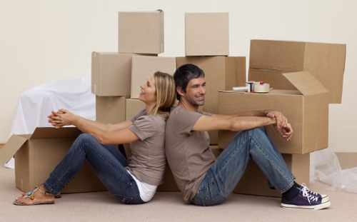 Office removals planning in Greenwich with moving boxes and workspace setup