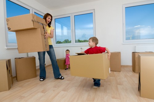 Professional Greenwich moving specialists organizing packed boxes