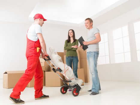 Office relocation team handling furniture and equipment in Greenwich