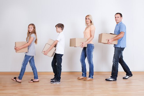 Professional movers organizing and protecting belongings